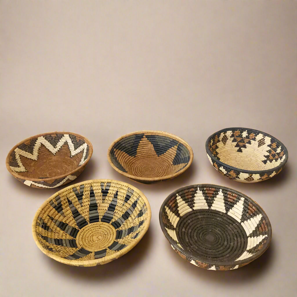 Colorful handmade Zulu bowl collection with geometric patterns in natural fibers