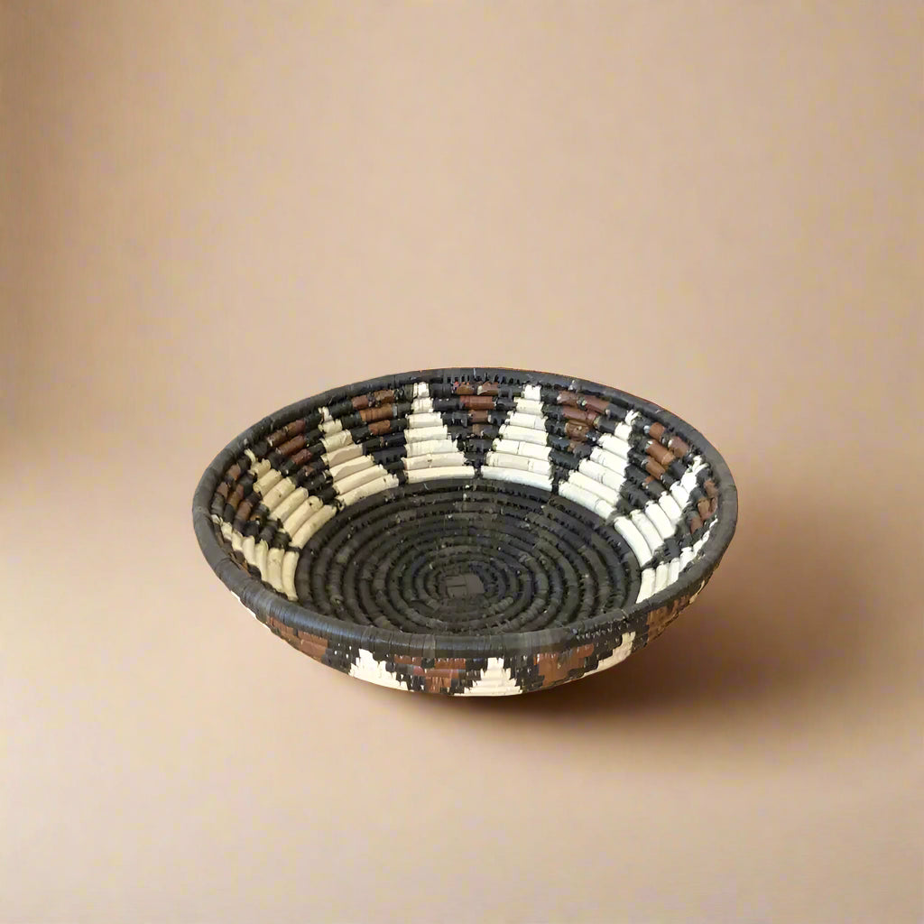 Handwoven African Zulu Bowl with black, brown, and off-white geometric pattern