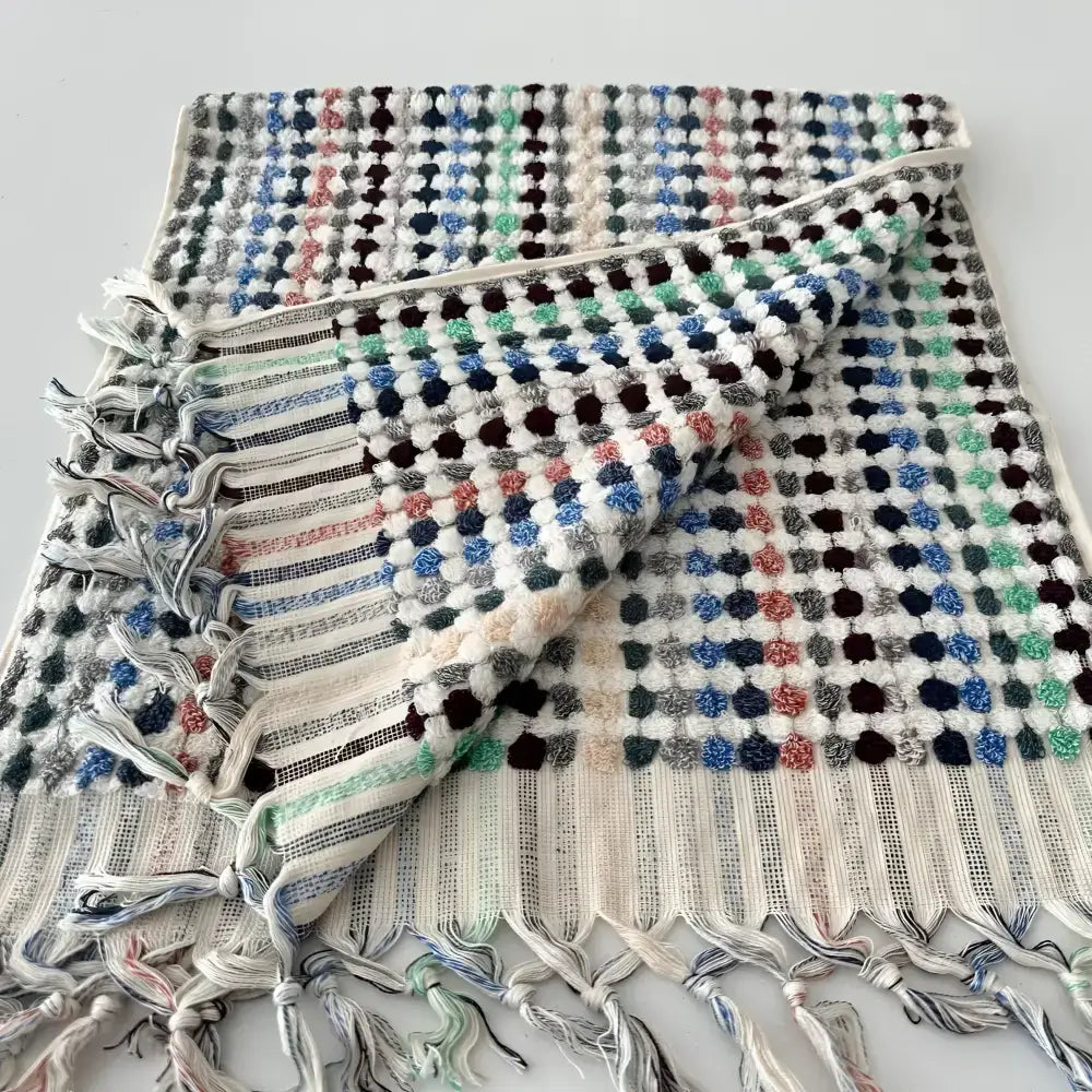 Colorful textured polka dot Turkish towel with fringes for authentic Turkish bath