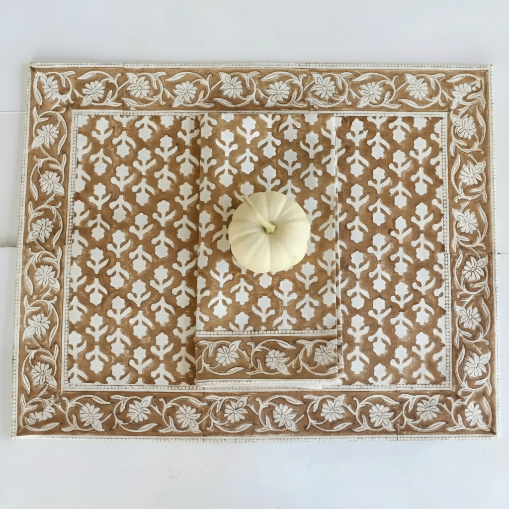 Brown and white caramel block print placemat and napkin set with small white pumpkin
