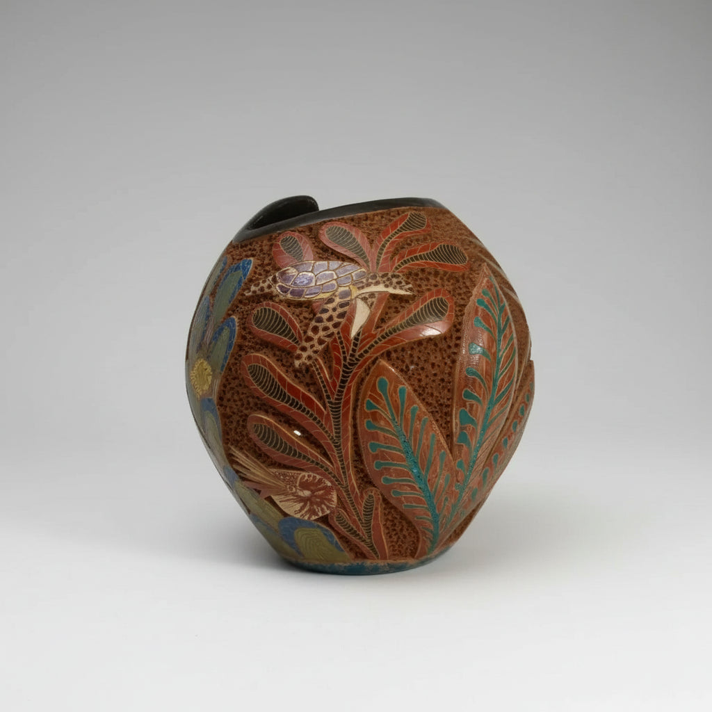 Carved Clay Turtle Vase with intricate botanical and aquatic designs in rich earthy tones