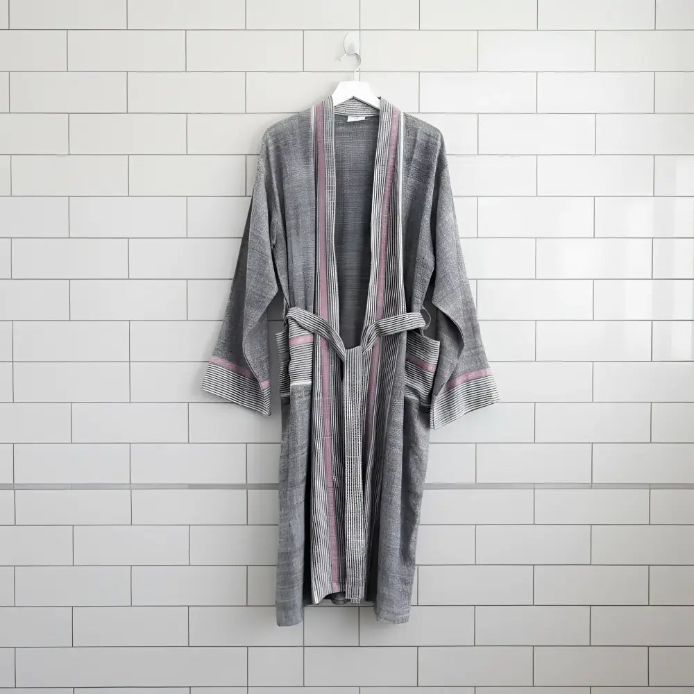 A soft gray bathrobe with ruby striped turkish towel colors, ribbed cuffs, and matching belt made of turkish cotton