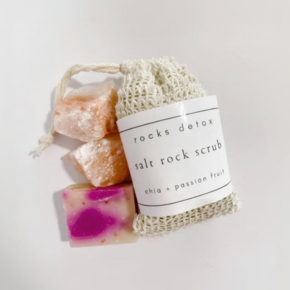 White mesh bag with Chia + Passion Fruit Body Scrub and pink orange Himalayan salt rocks