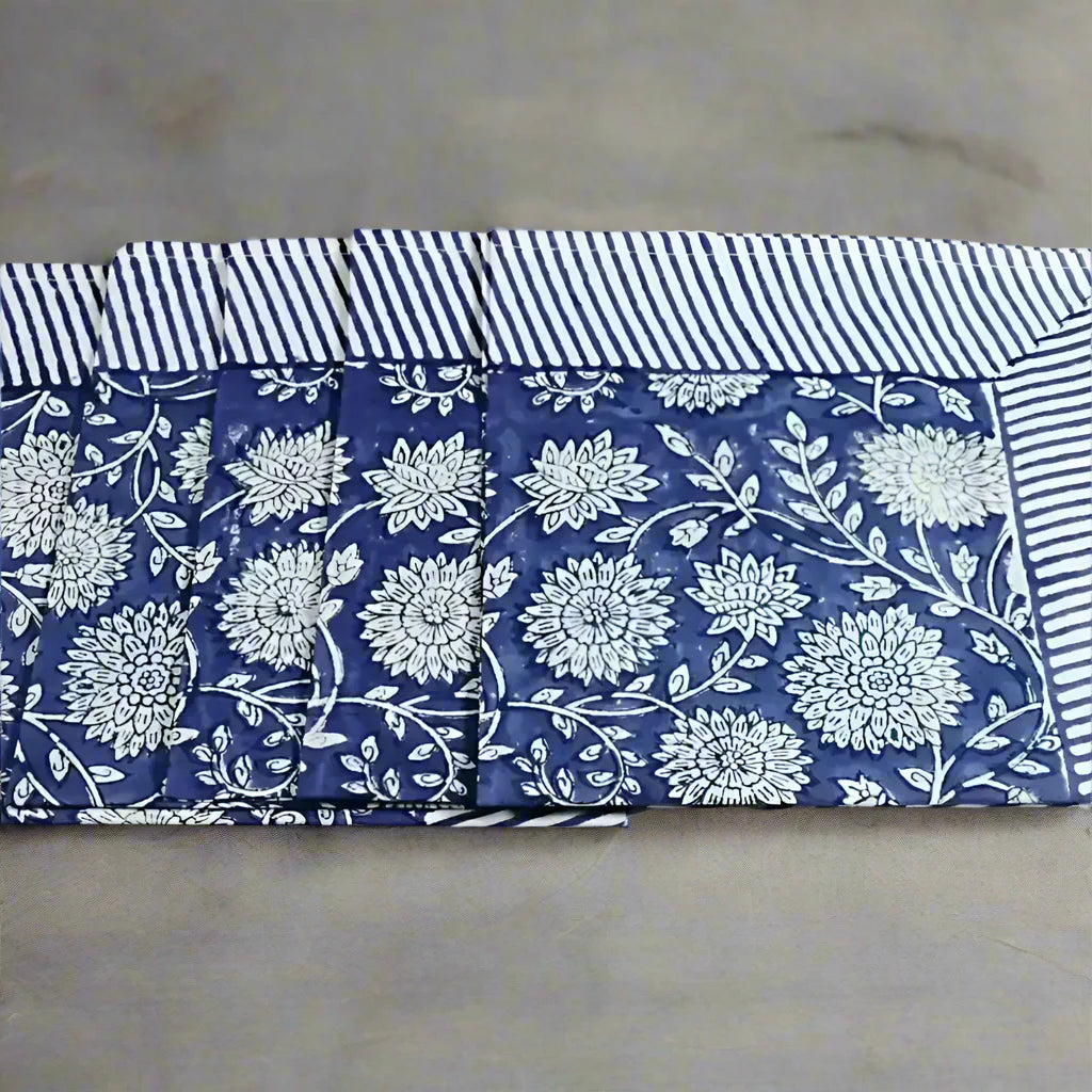Blue and white floral cotton napkins with striped borders, traditional block print design