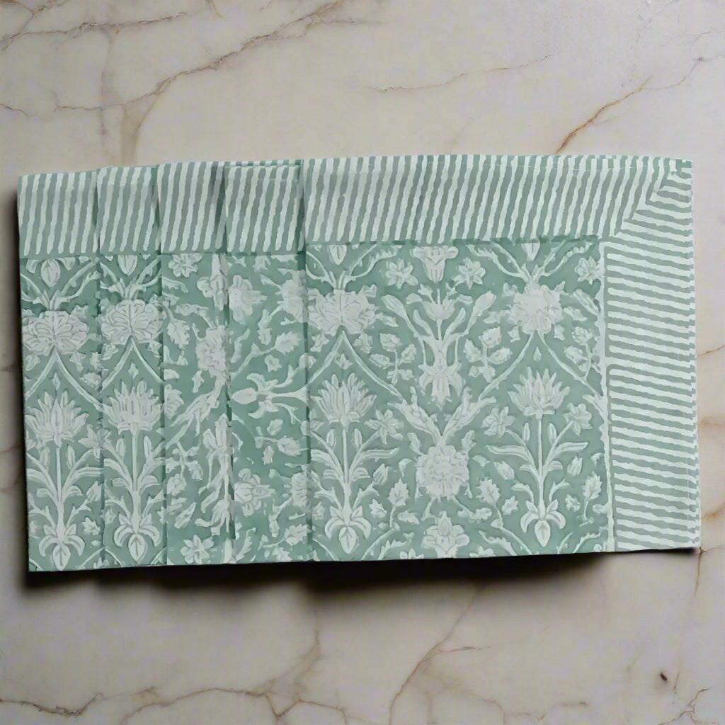 Green and white floral and striped cotton napkins with traditional Indian block print