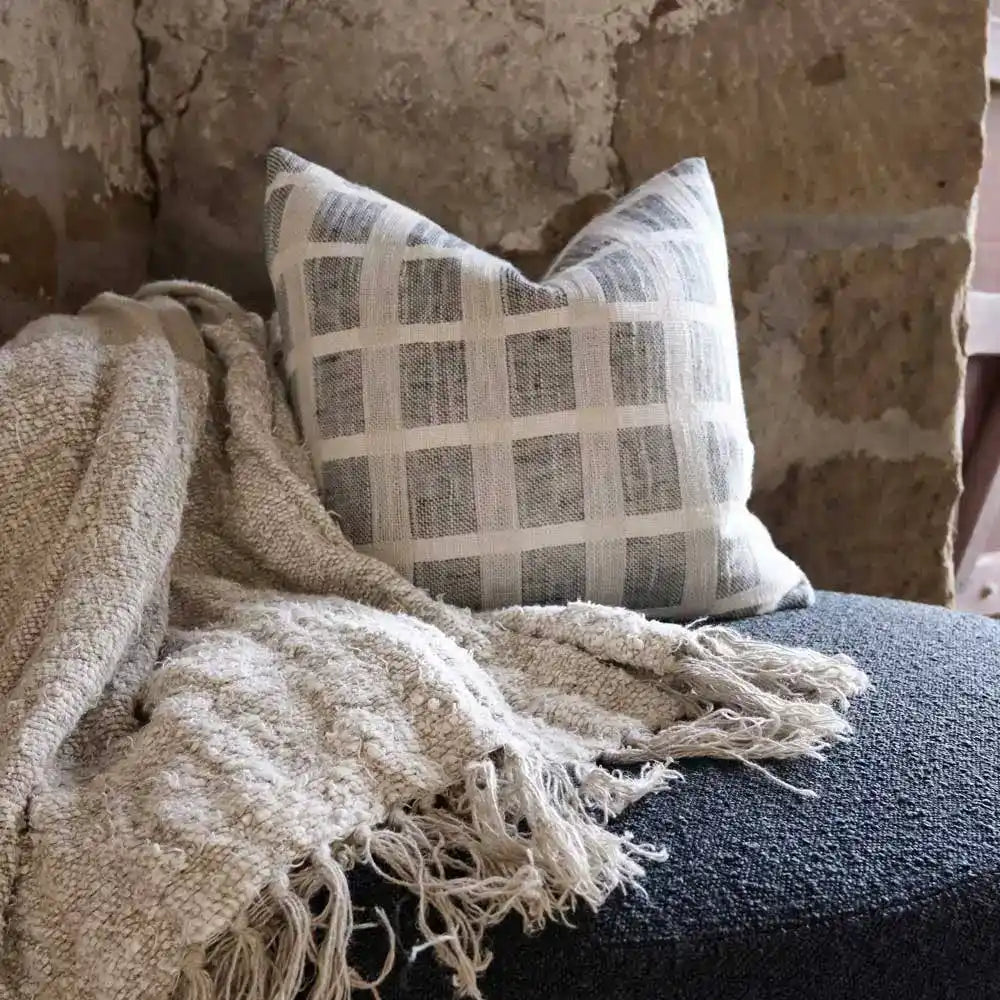 Linen pillow cover with grid design in off-white and slate colors.