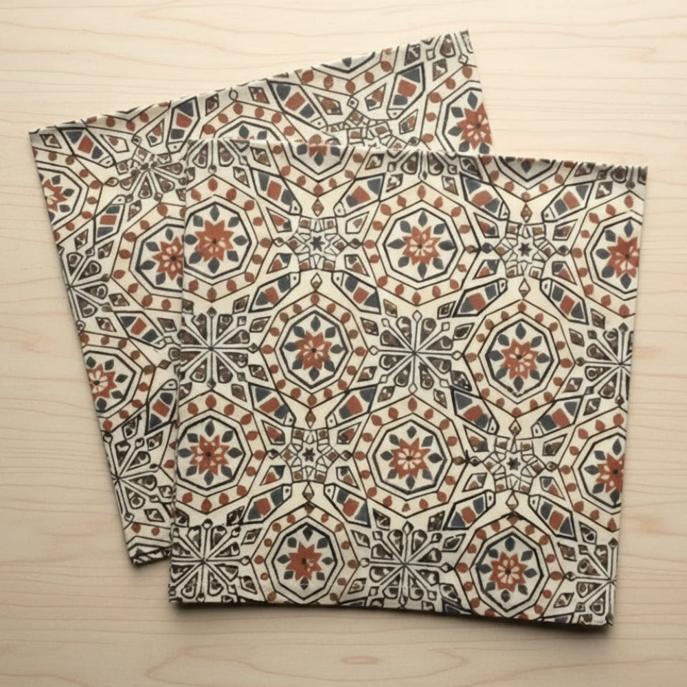 Two hand block printed fair trade organic cotton cloths with intricate geometric patterns