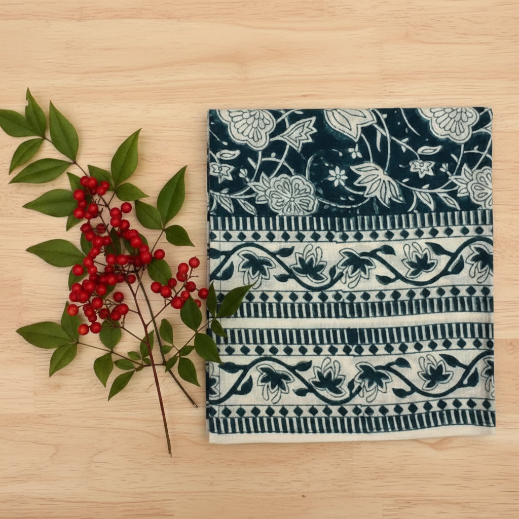 Hand block printed fair trade cloth napkin with dark teal and cream floral pattern