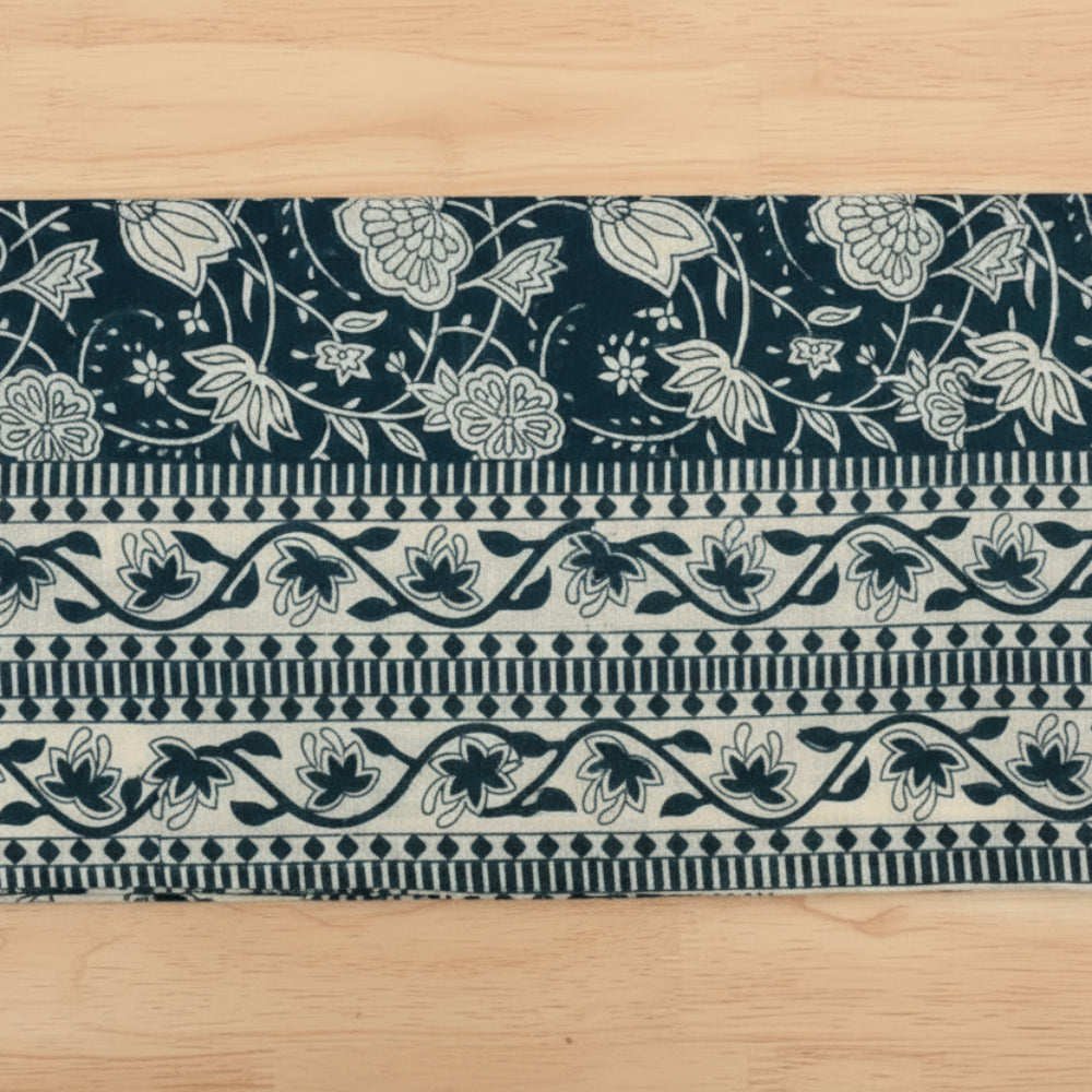 Hand block printed fair trade cloth napkin with dark teal and cream floral pattern