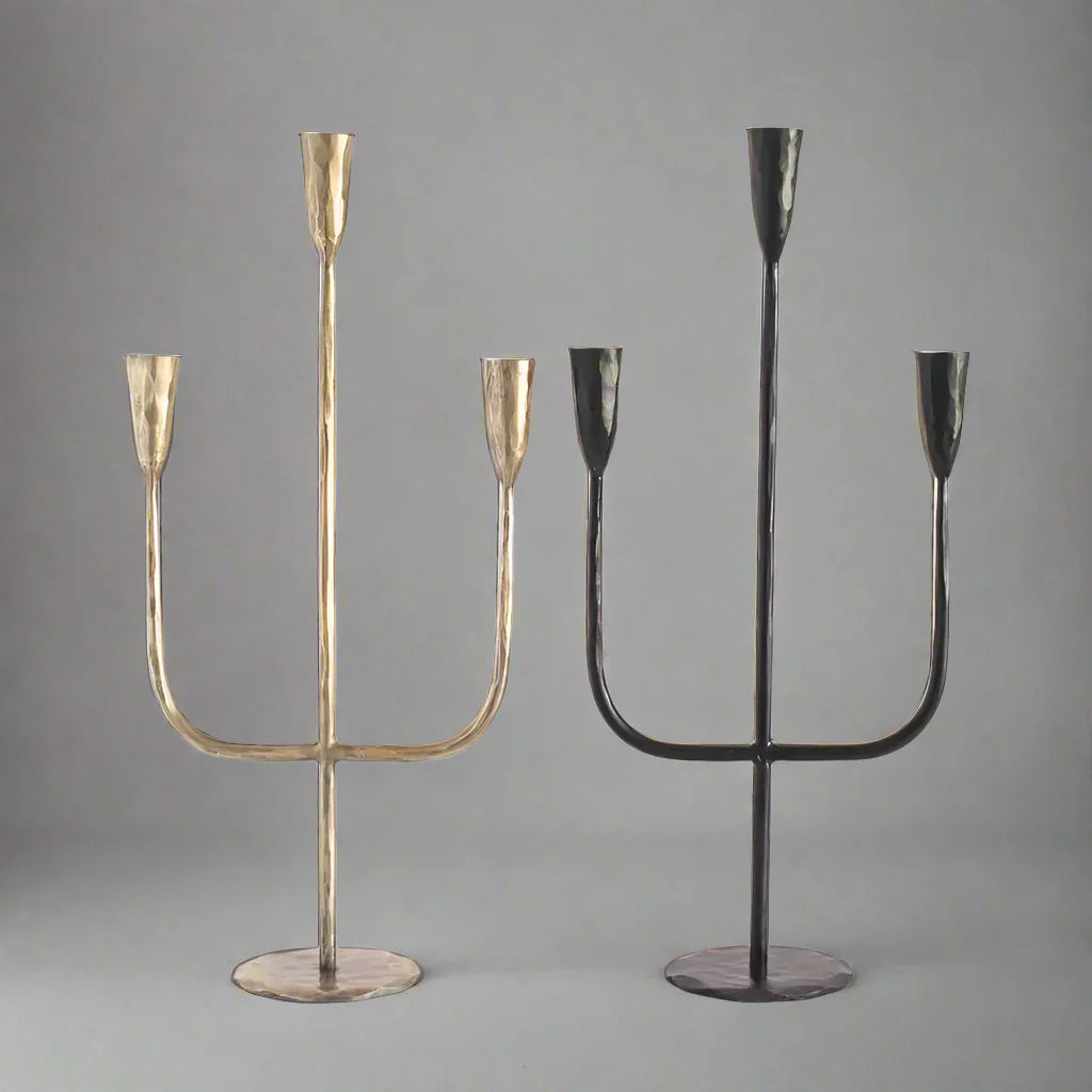 Two hand-forged iron candelabras in gold and black finishes by expert blacksmiths for premium feel decor
