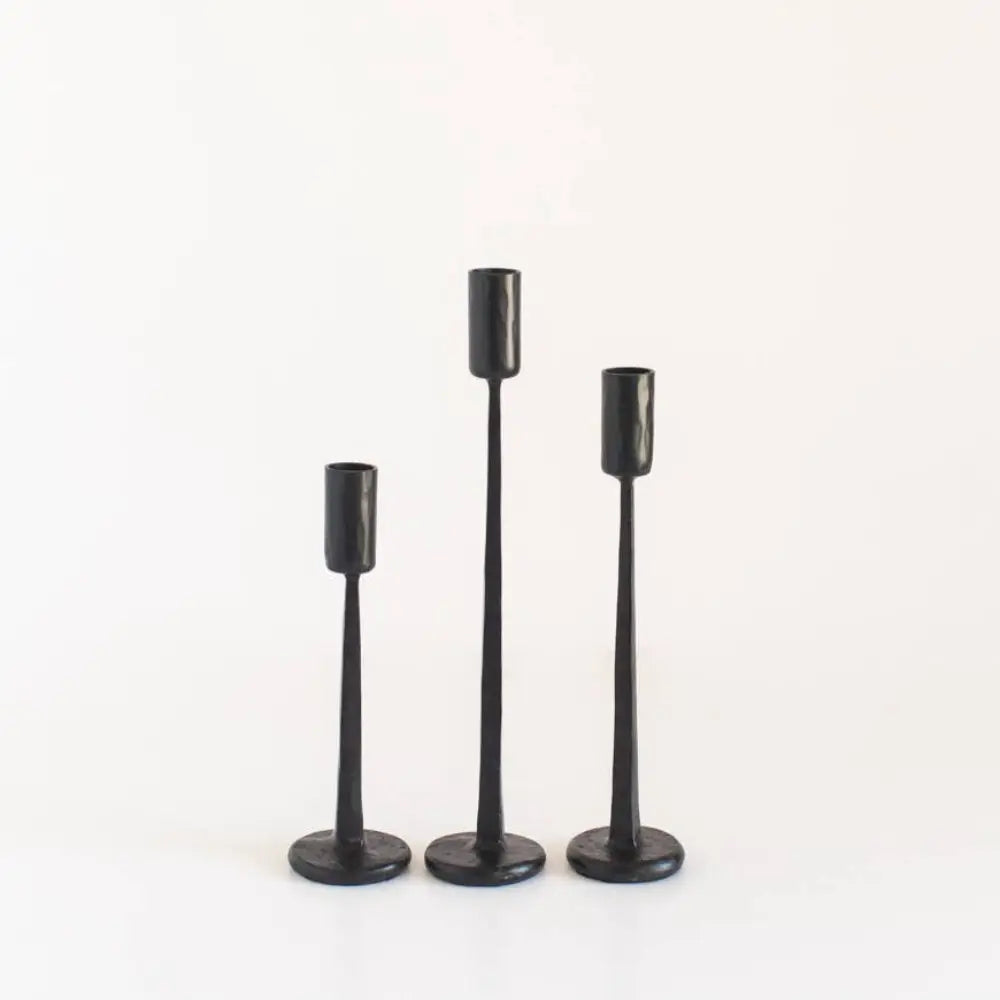 Hand Forged Iron Candle Stands set of three in black on a white surface