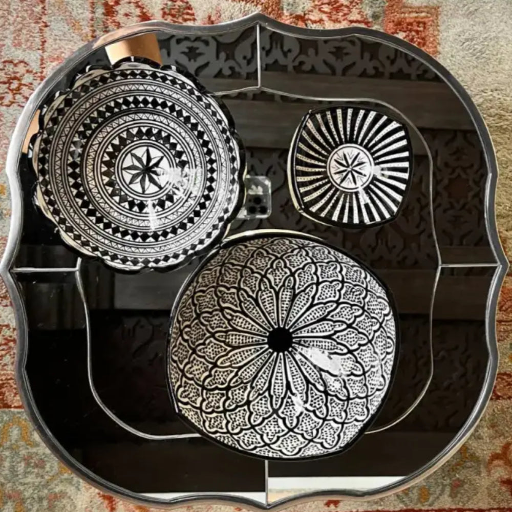 Three black and white handcrafted ceramic bowls from Safi Morocco featuring black patterns