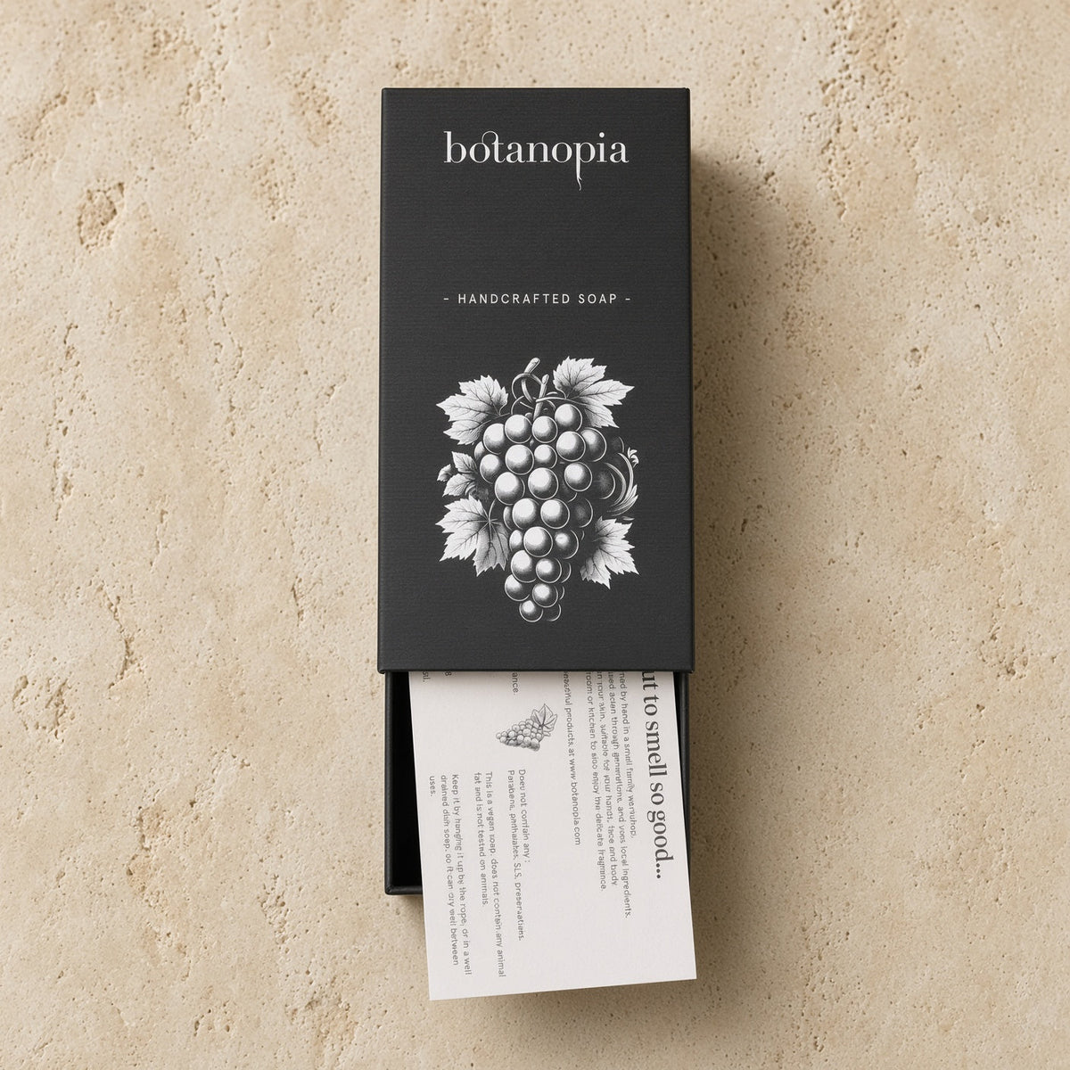Botanopia handcrafted grape soap in black box with white grape illustration made with olive oil for gentle cleansing