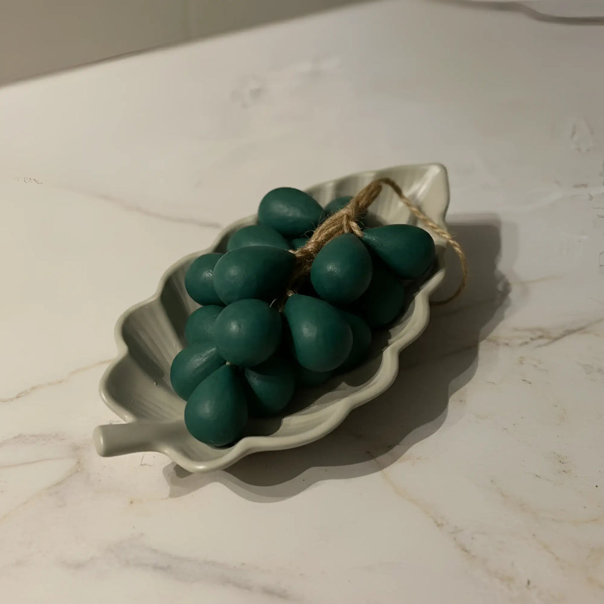 Handmade arabica leaf dish with teal-green grape ornaments