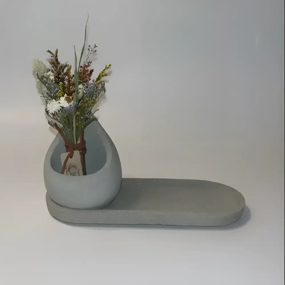 Handmade gray teardrop concrete vase with zero waste oval tray base