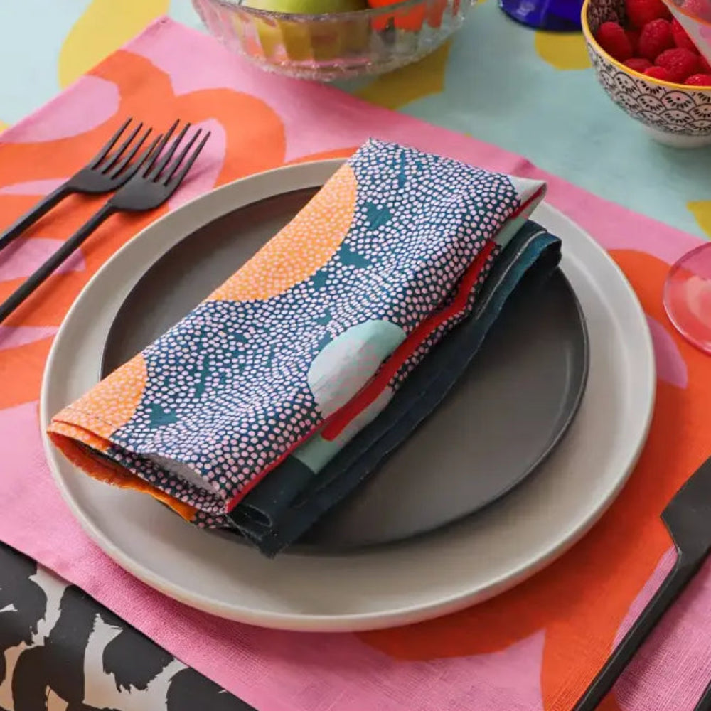 Handmade eco-friendly blue linen dinner napkins with patterned napkin and dark cutlery