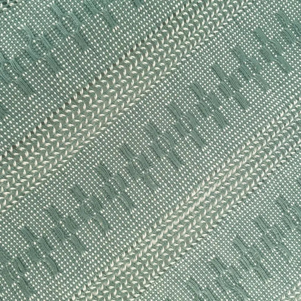 Table runner featuring sage green threads handwoven together in an intricate open weave technique called Calado.