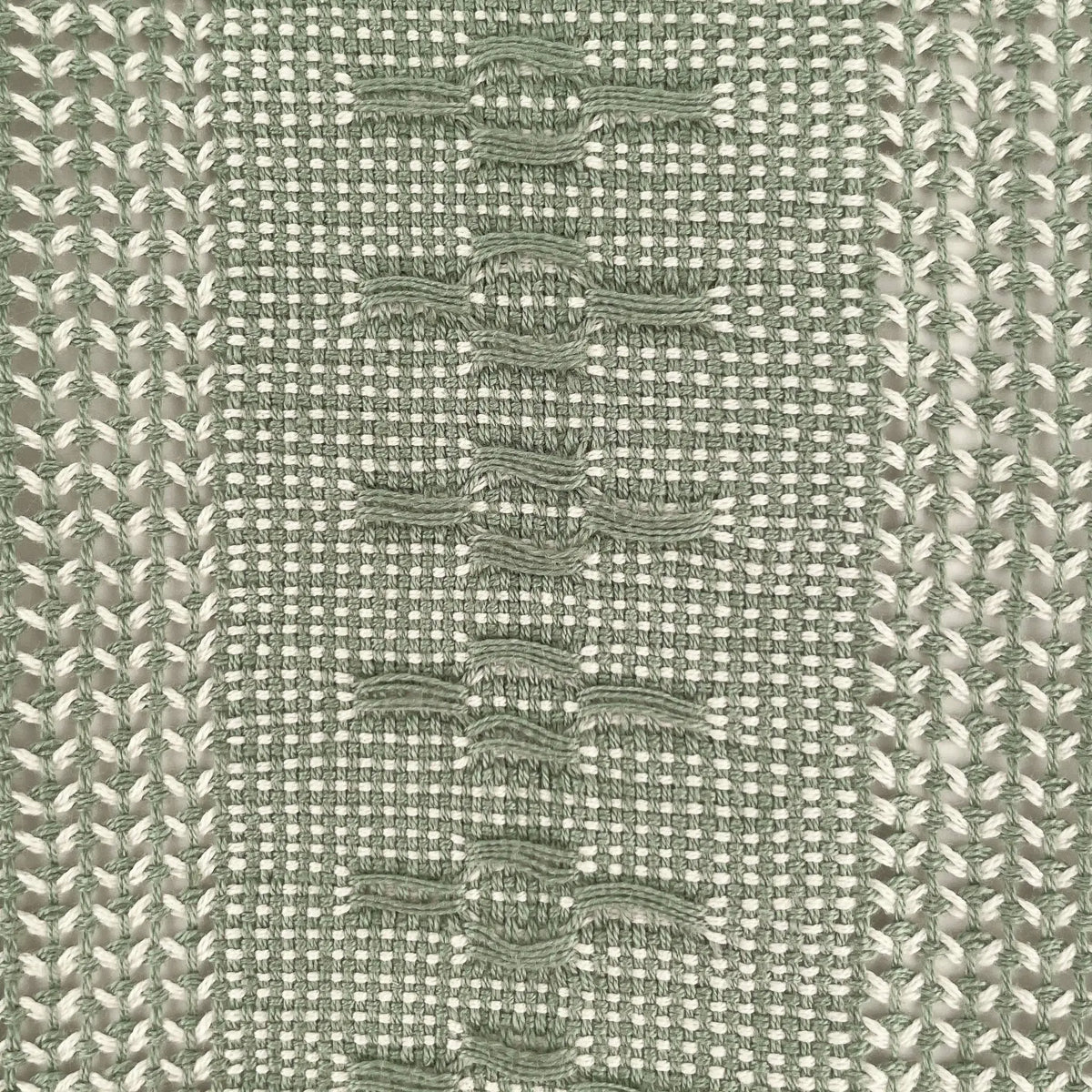 Handwoven calado table runner with olive-green checkerboard and white woven V-shapes