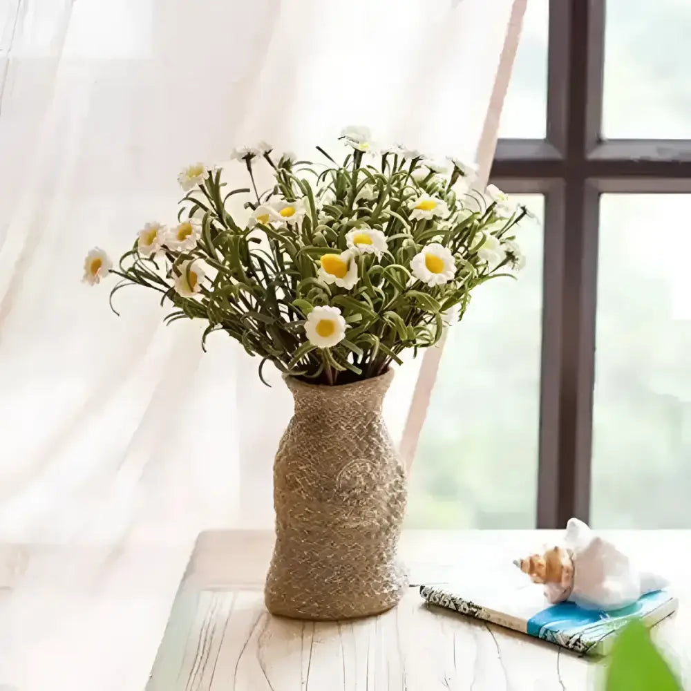 A vase shaped small planter with a woven bag shape and design