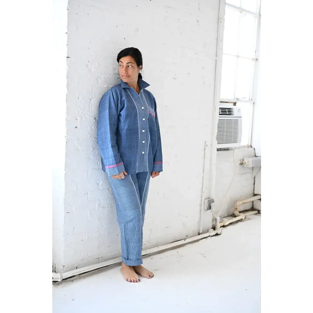Woman in Indigo Tribeca Loungewear Set with light blue long sleeve collared pajamas