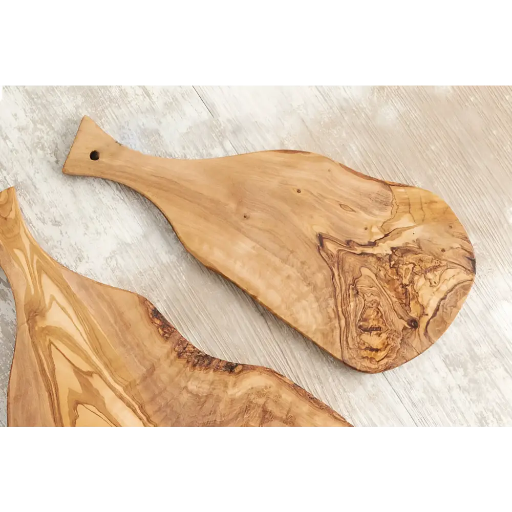 Italian Olivewood Charcuterie and Cheese Paddle Board on a light colored surface