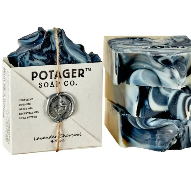 Lavender Charcoal Wrapped and unwrapped soap bar on a white background