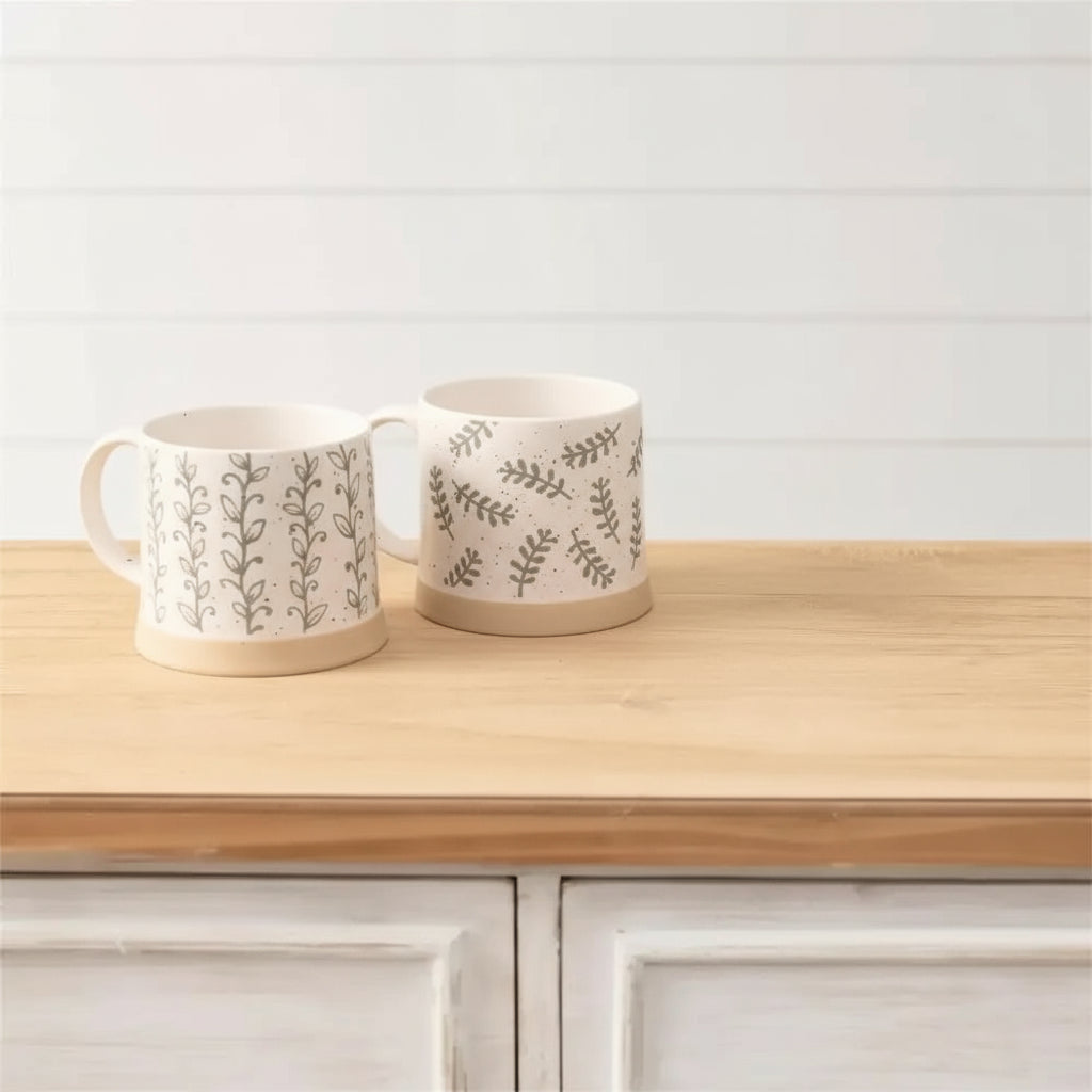 Set of three leafy green stoneware mugs with nature-inspired patterns perfect for your kitchen
