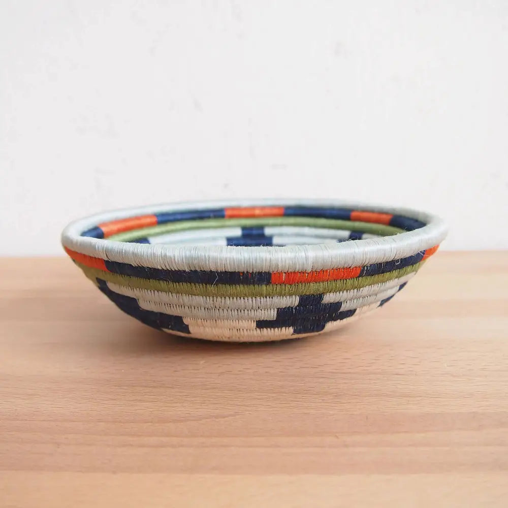 Handmade mwangaza small bowl with a geometric pattern in navy orange olive green and white eco-friendly handcrafted design