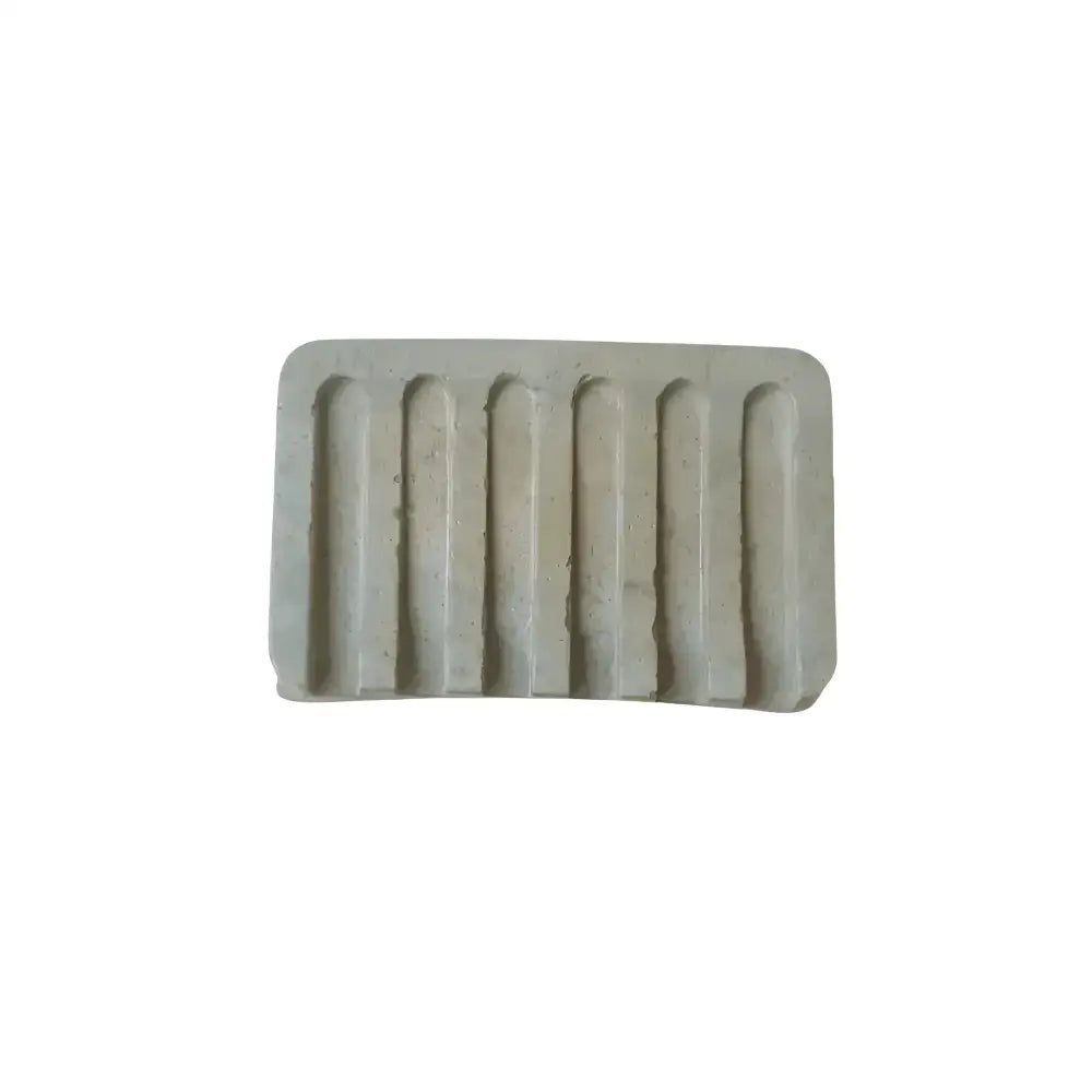 Light-colored soap dish with eight concave ridges from the Preen Your Feathers Robe set