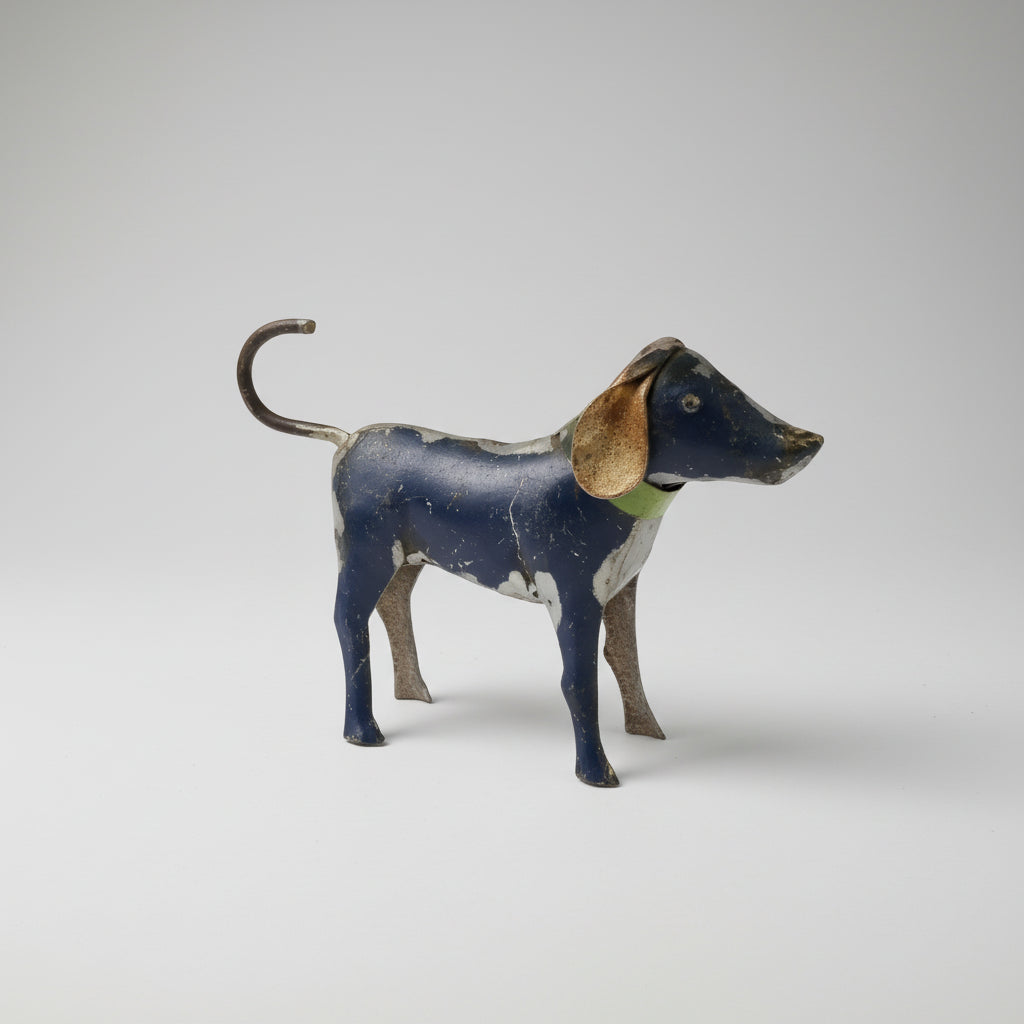 Vintage dark blue and white reclaimed metal dogs figurine with tan ears and green collar