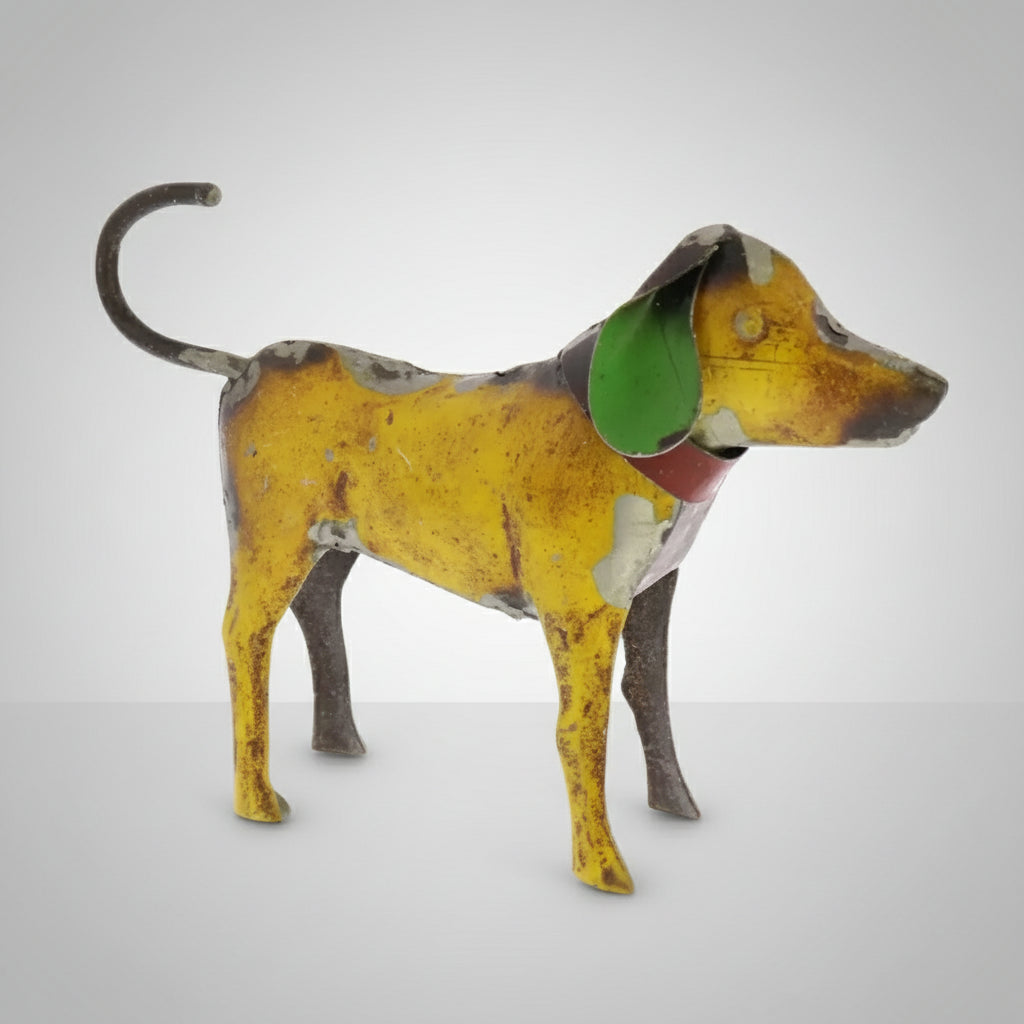 Weathered yellow reclaimed metal dog figurine with green ears and red collar