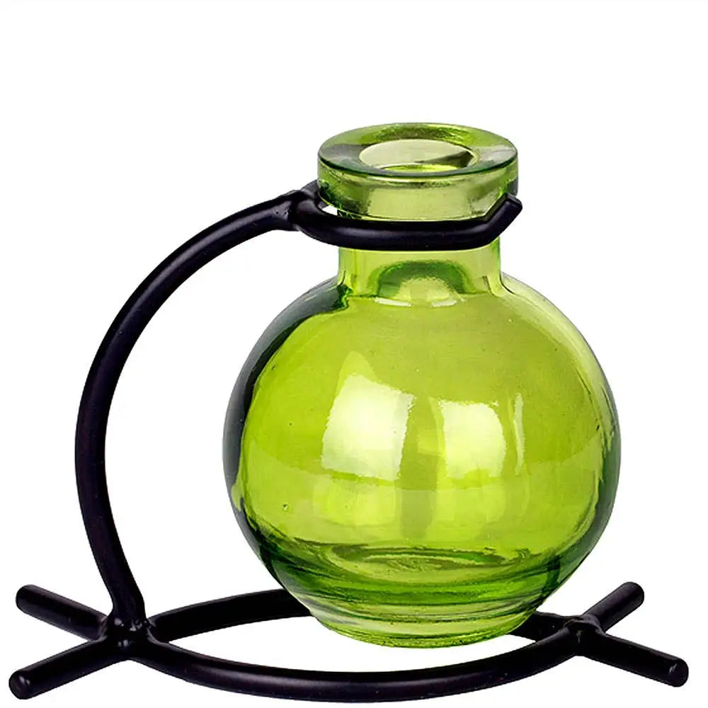 Recycled glass mini vase with black metal stand holding pink flowers