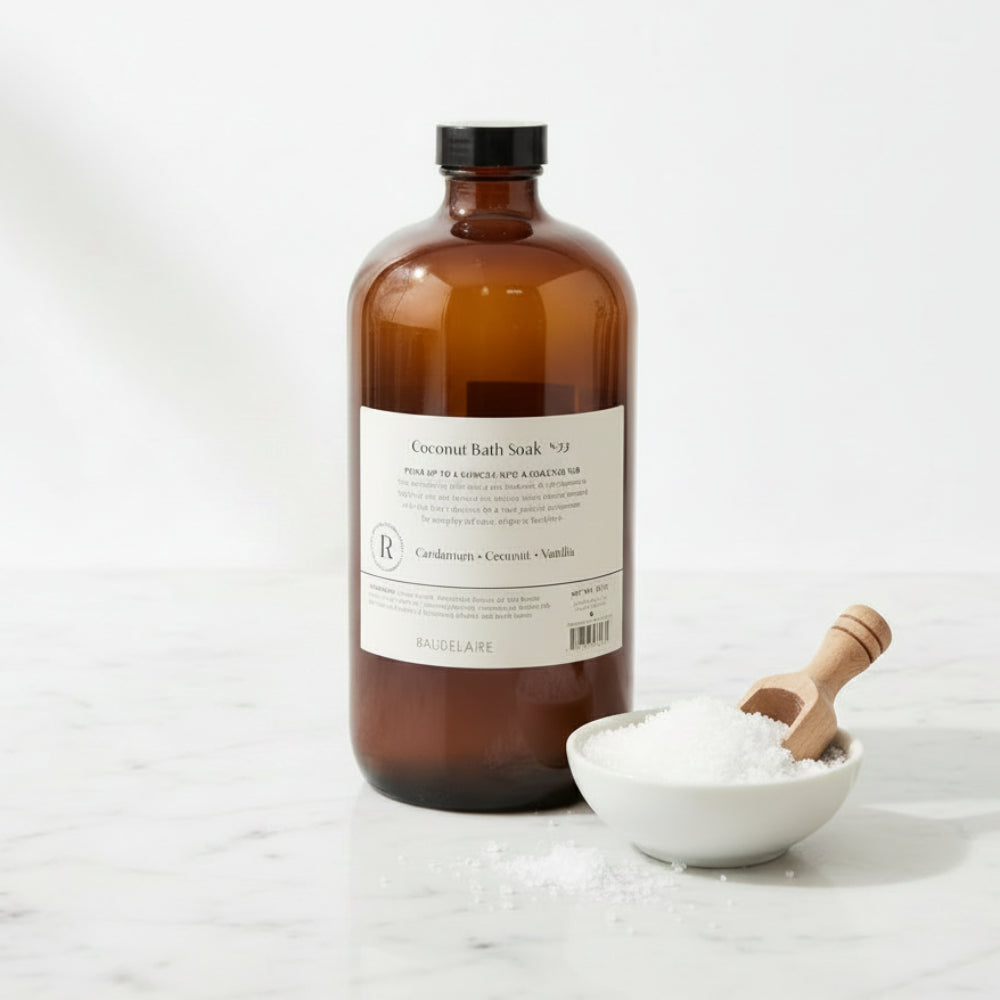 Handcrafted Baudelaire Replenish Coconut Bath Soak in amber glass bottle