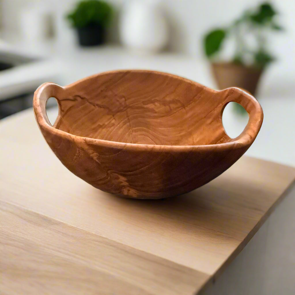 Rustic Teak Bowl with Handles on wooden board with plants in background