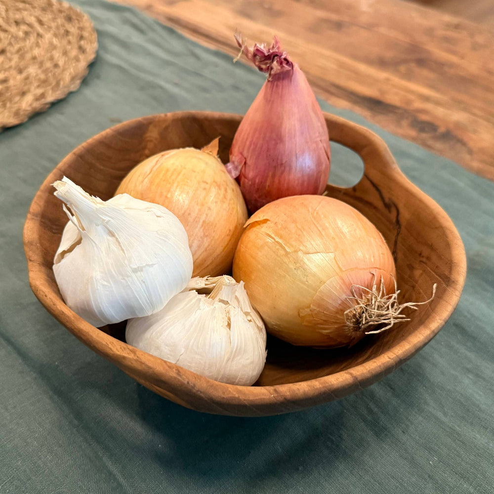 Rustic Teak Bowl with Handles filled with garlic and onions