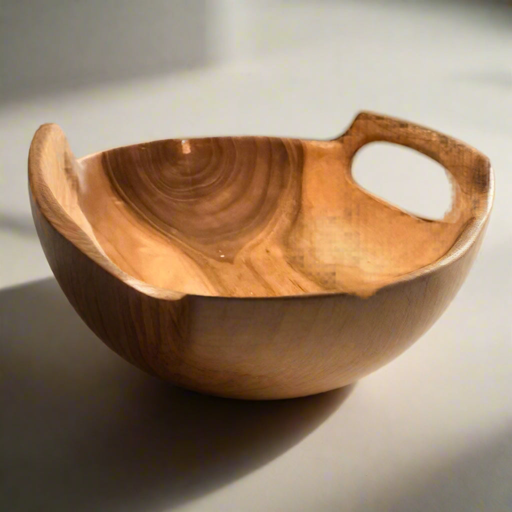 Rustic Teak Bowl with Handleson a white surface