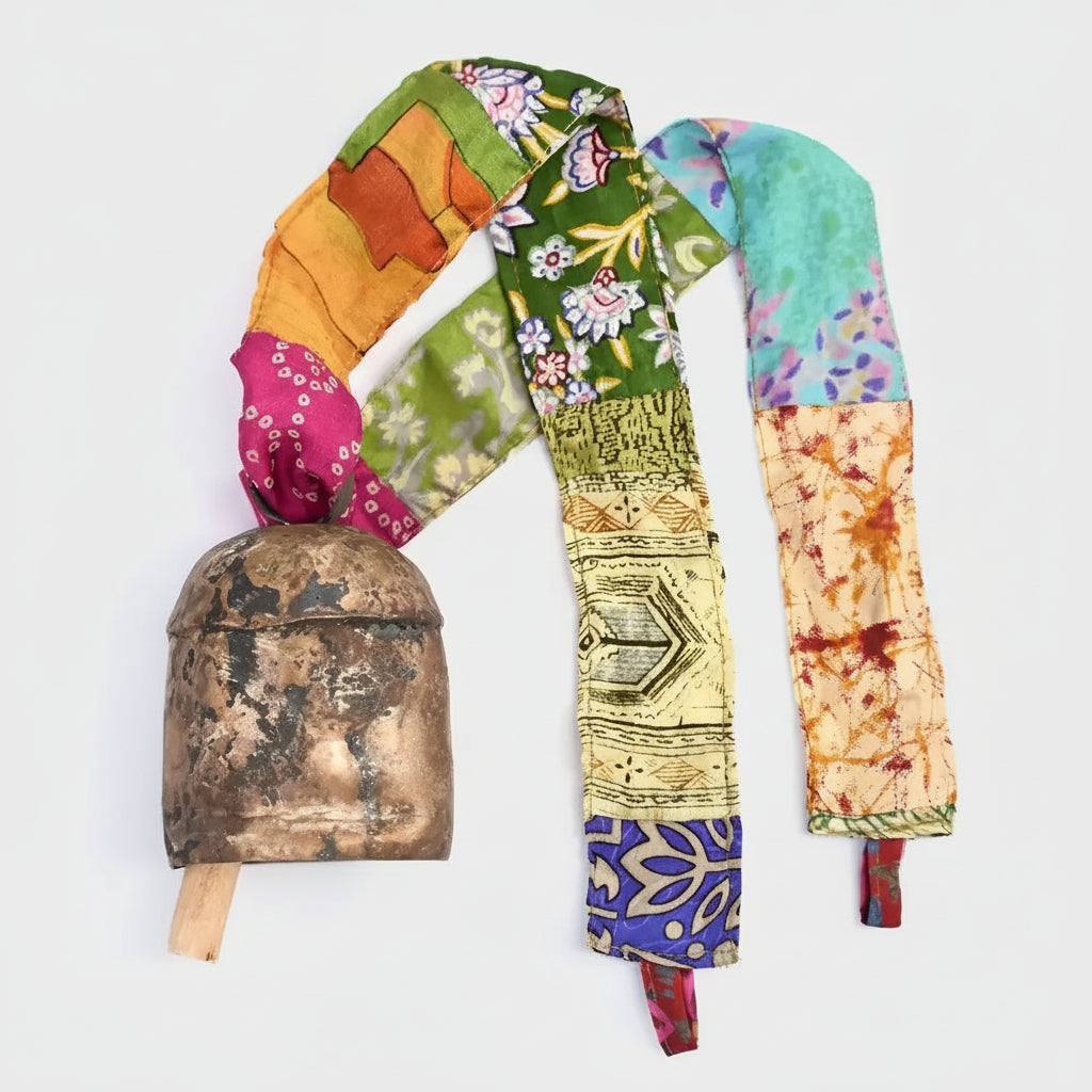 Antique copper bell with upcycled sari fabric strap in the Sari Ribbon Bell collection