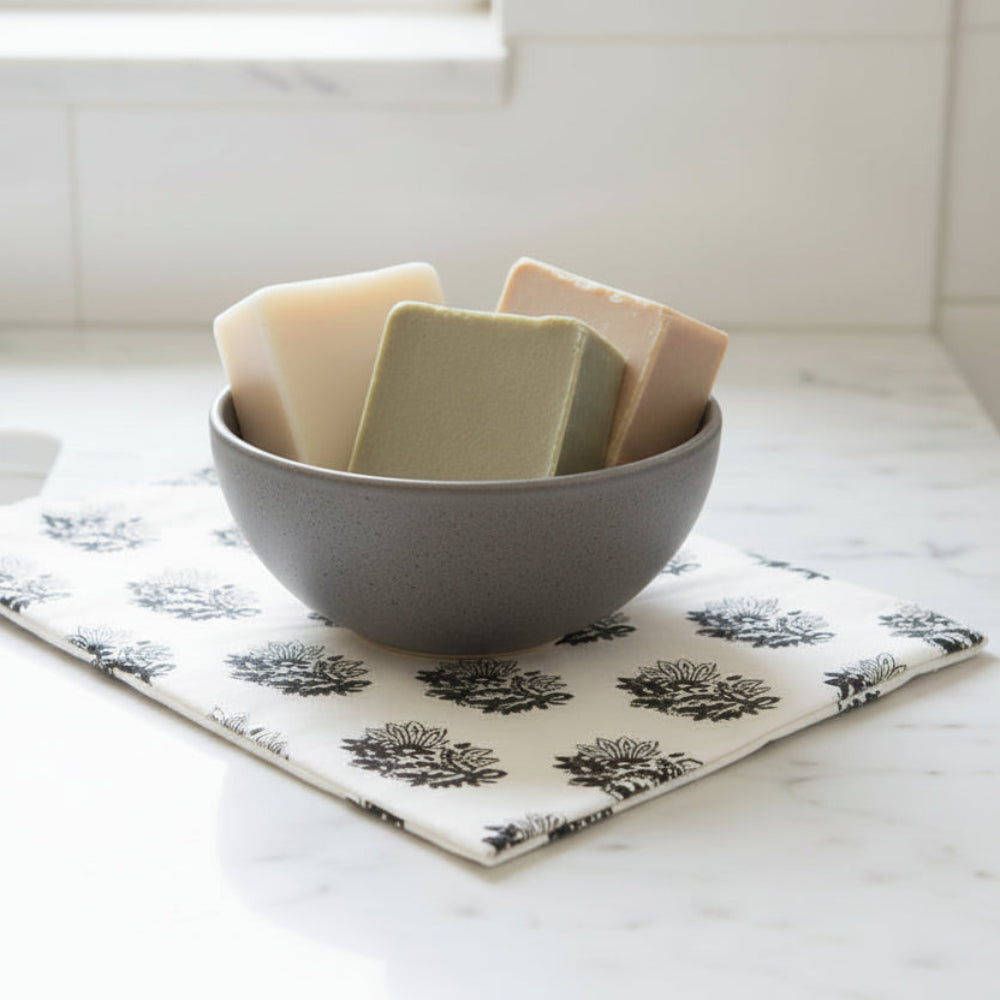 Handcrafted soapstone bowl with white ribbon and gold scissors