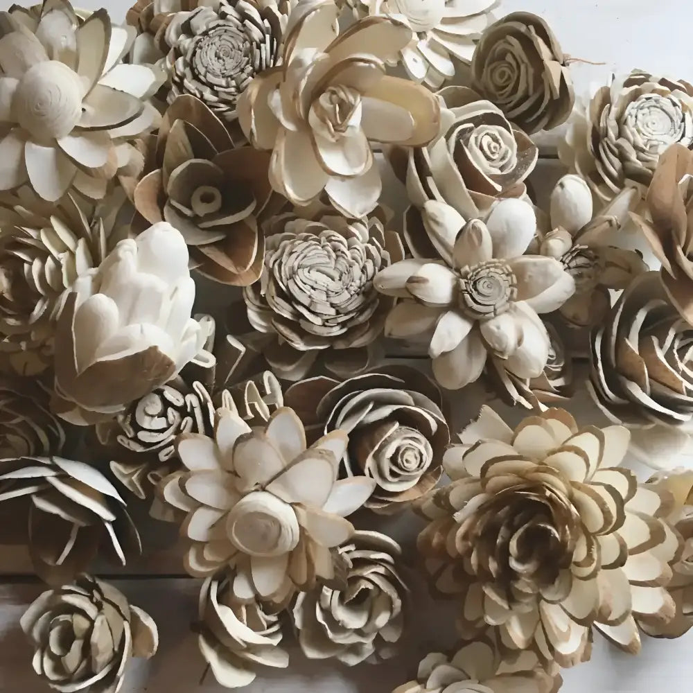 Handcrafted sola wood flowers in various styles and shades of cream and light brown
