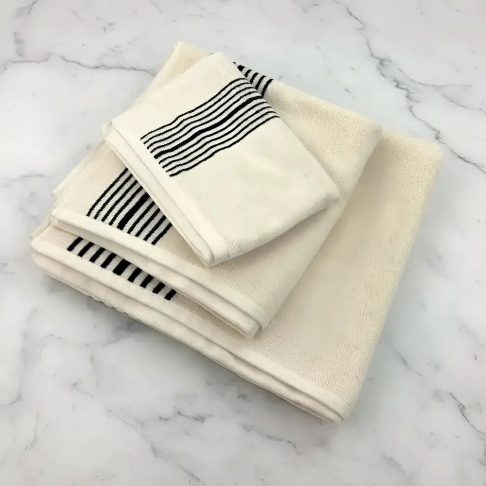 Melika Turkish cotton striped hand towel in cream with black edges for spa-like experience