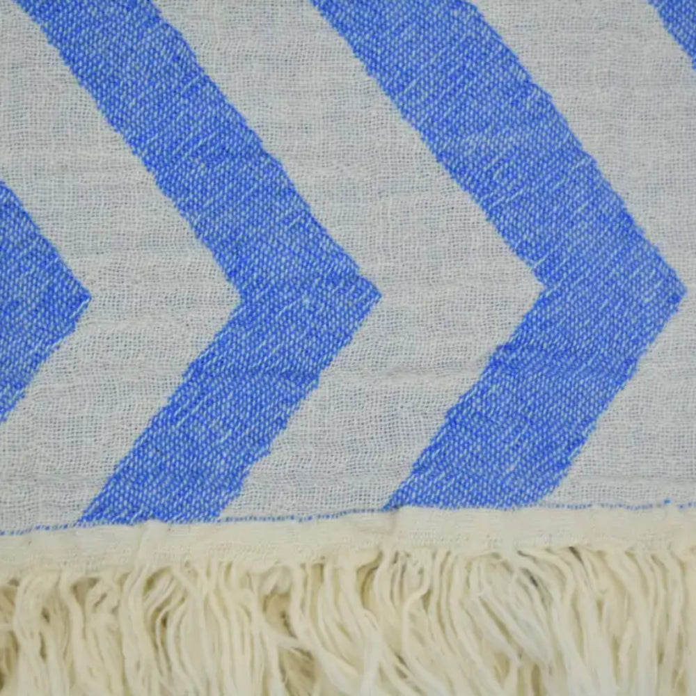 Turkish towel with zigzag design pale sax blue chevron pattern and cream-colored fringe for stylish use