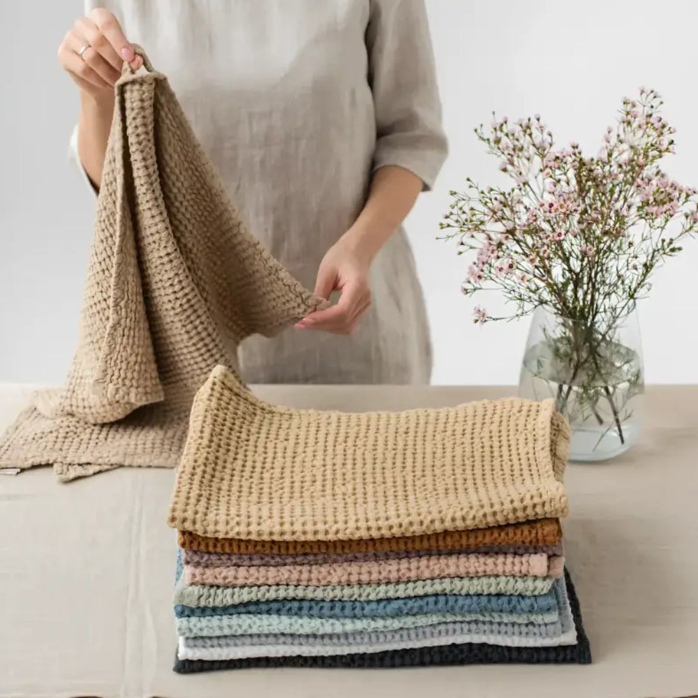 Colorful linen-cotton blend waffle kitchen towel stack showing specialized waffle weave
