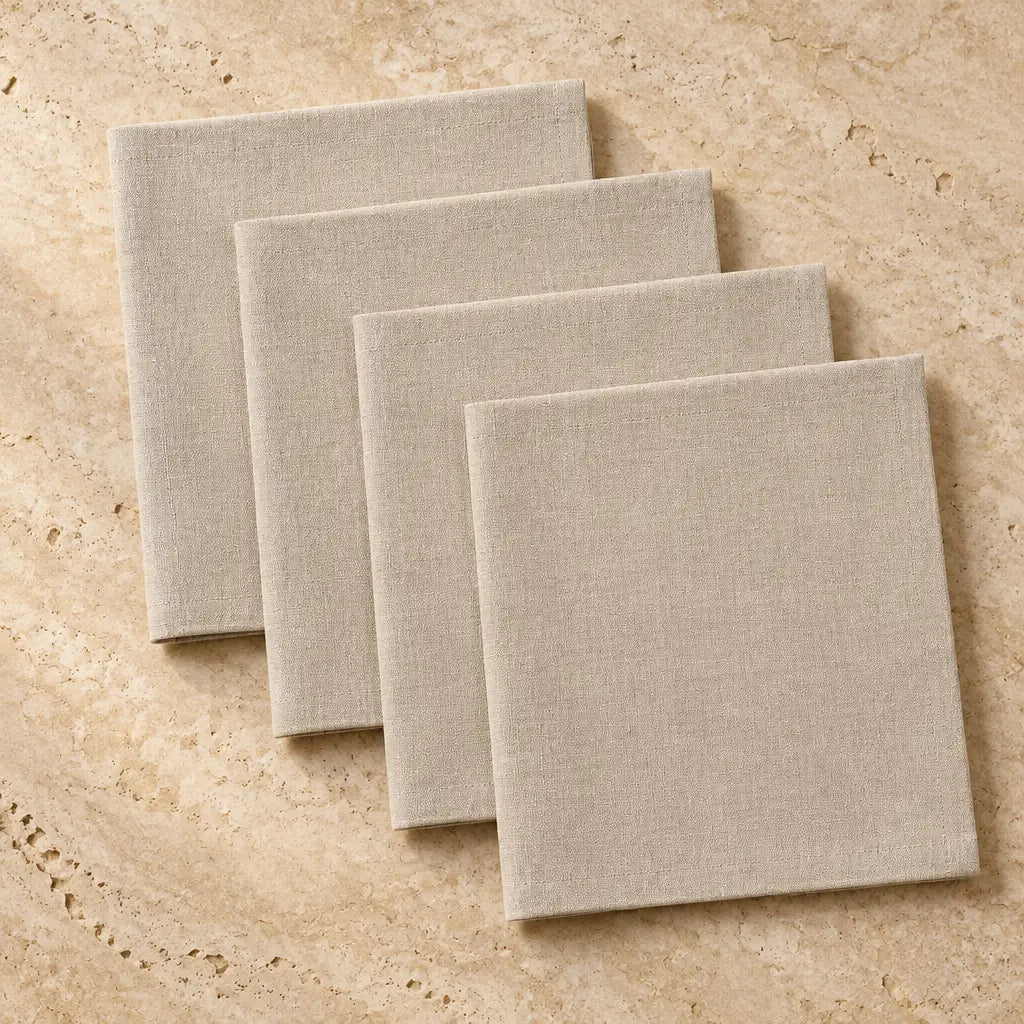 Set of four oyster color cloth napkins made of beige linen with a subtle woven texture perfect as neutral napkins