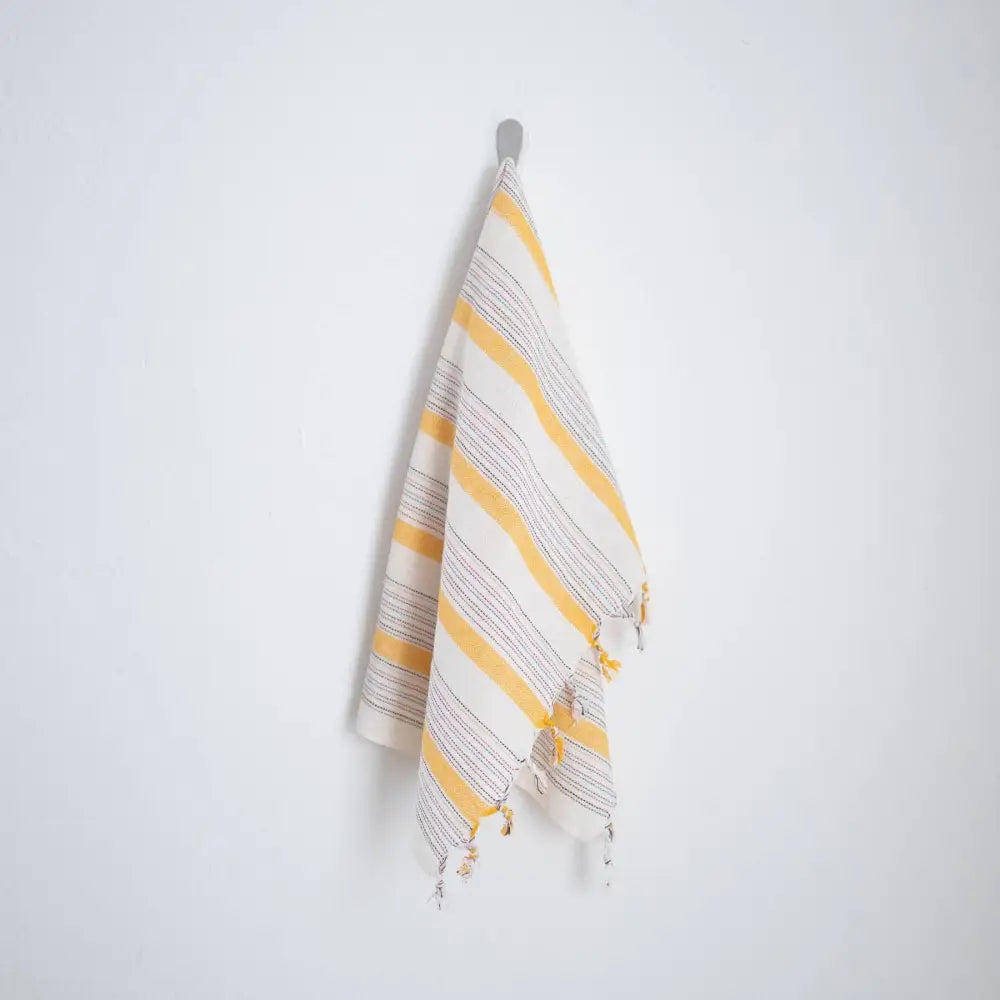 Ivory and yellow Turkish cotton hand towel with tassels and striped yellow and white design