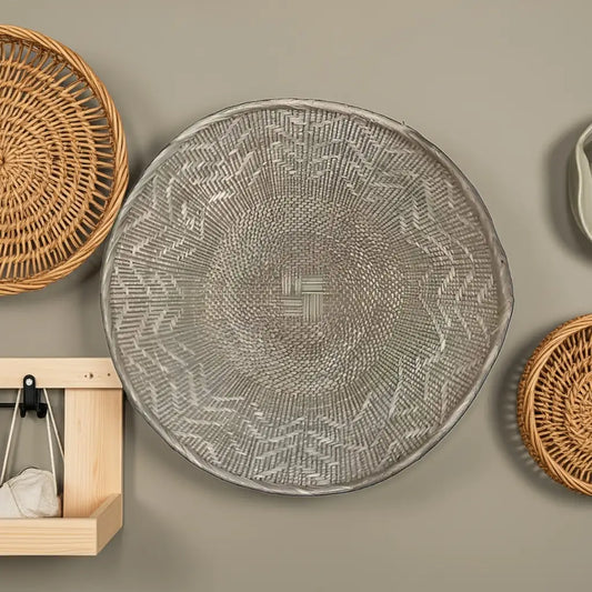 Round woven wall basket with intricate patterns showcasing handmade eco-friendly craftsmanship