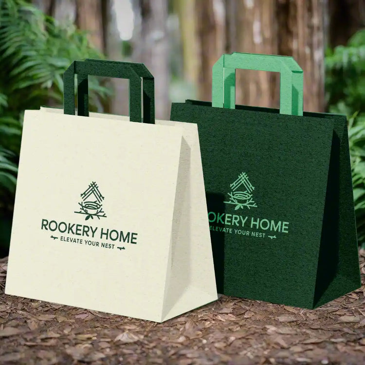 Two paper shopping bags in cream and dark green with matching handles from All Products Artisan Decor Natural Textiles