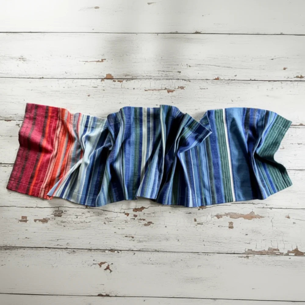 Colorful crumpled table runner in blues, reds, and oranges.