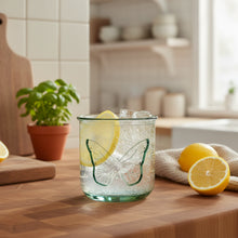 Handmade 10 Oz Classico Butterfly Tumbler with recycled glass, ice, and lemon