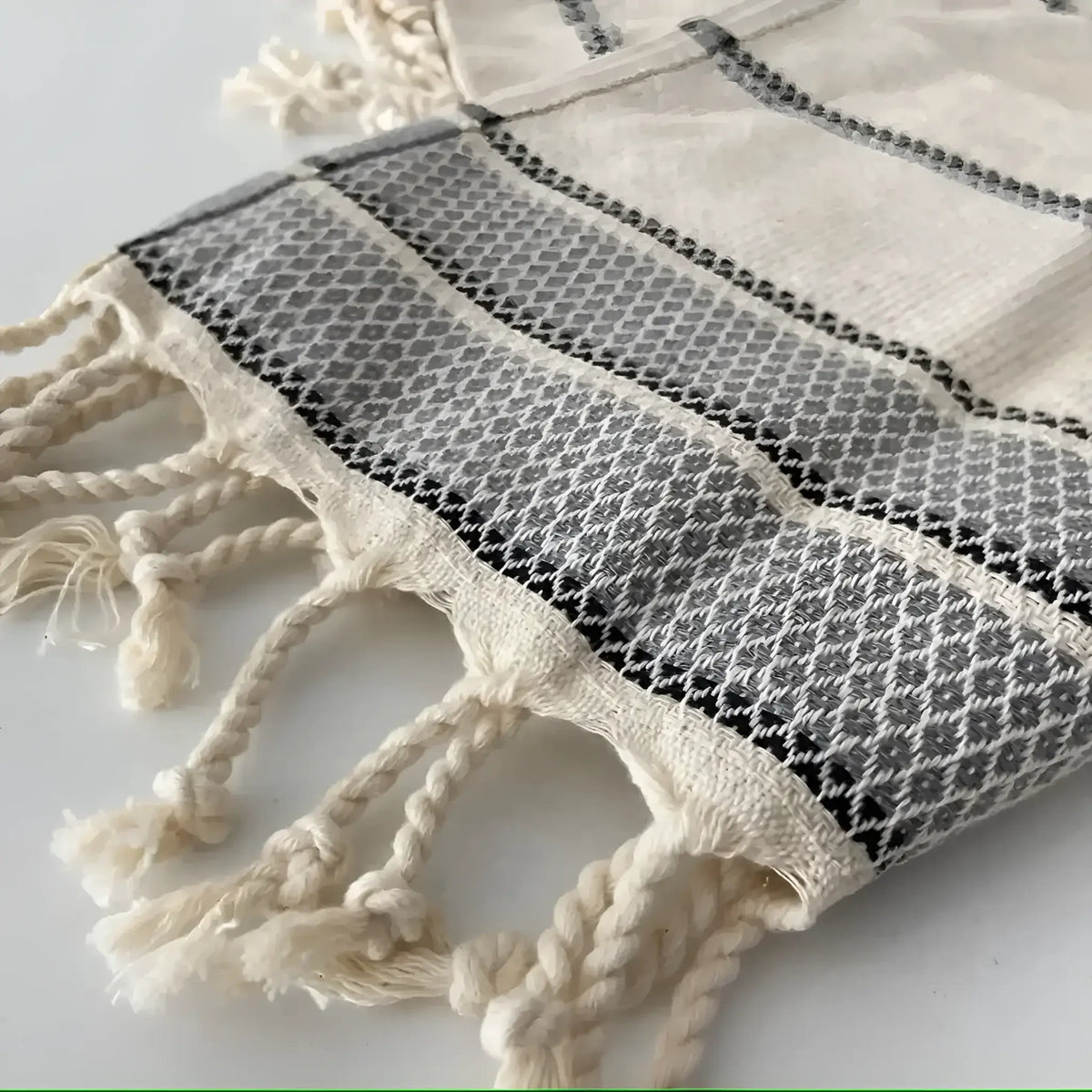 White and black patterned Turkish hand towel with tassels, perfect linen wash towel