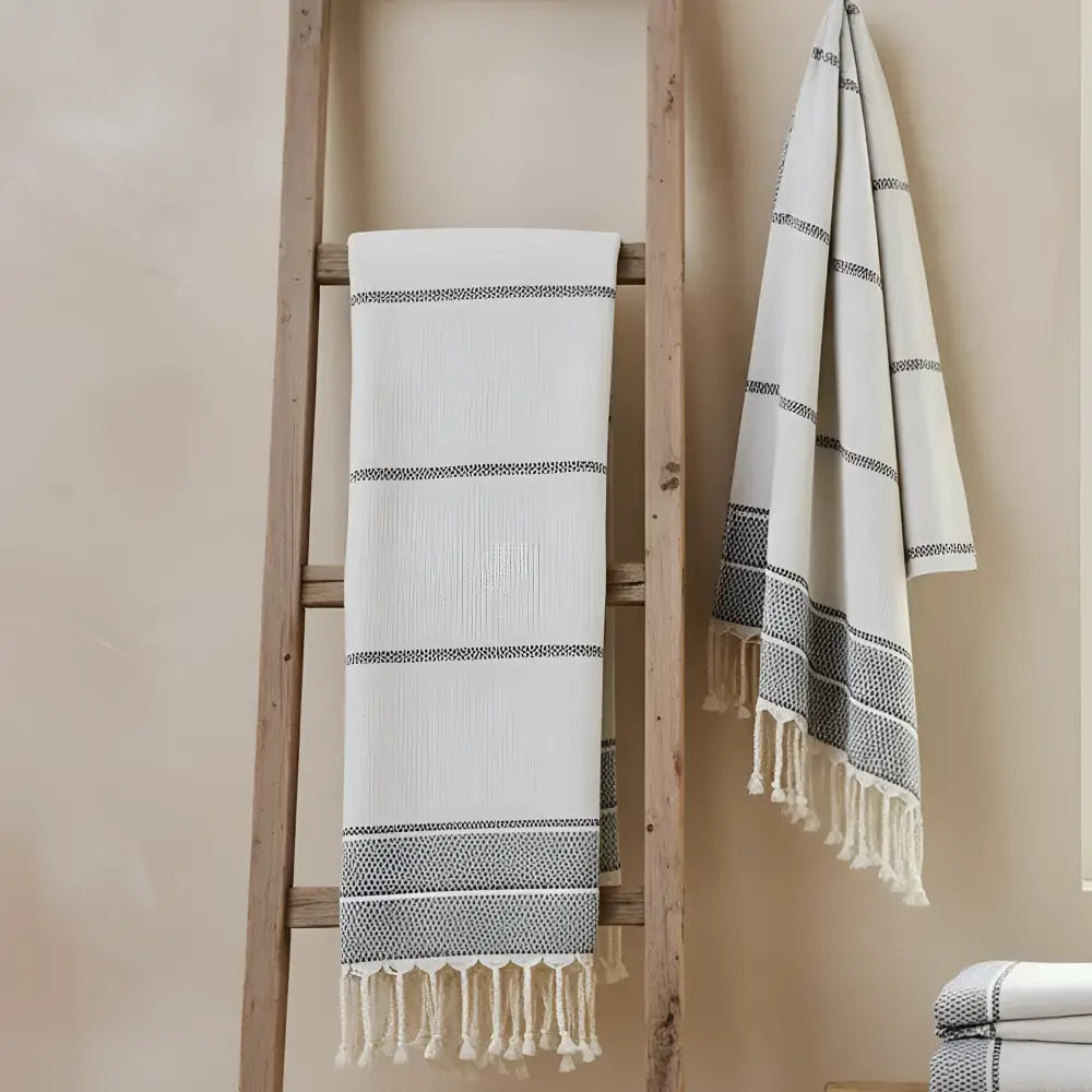 White turkish hand towel with gray stripes and textured fringe made of 100% linen perfect as a turkish linen towel